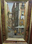 Oil on card in heavy decorative frame of Mediterranean street scene, signed Promano. Estimate £50-