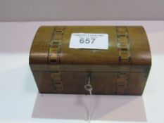 Victorian walnut dome top tea caddy with Tunbridge-style inlays, lock & key. Estimate £20-30.