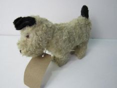 1950's clockwork mohair dog. Estimate £20-30.