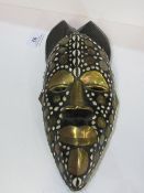 Unusual Ashanti brass inlaid African female tribal mask by the Akan people. Estimate £20-30.