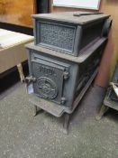 A JØtul 118 wood-burning stove. Estimate £100-150.