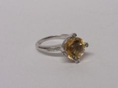 18ct white gold, citrine & diamond ring, wt 5.6gms, size O. Estimate £300-350.