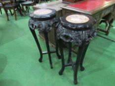 Pair of Chinoiserie-style ebonised jardinière stands with marble tops. Estimate £40-60.