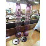 Pair of Kenneth Turner amethyst glass lidded vases. Height 22cm. Estimate £10-20.