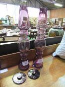 Pair of Kenneth Turner amethyst glass lidded vases. Height 22cm. Estimate £10-20.