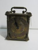 Smiths engraved brass clock with self start movement and Roman numerals 11cm high. Estimate £20-40.