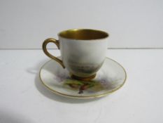 Royal Worcester porcelain coffee cup and saucer decorated with pheasants, with heavily gilded