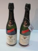 2 bottles of vintage 1980's Kriter Estra Leger Vin Mousseux, Black Top. Estimate £20-30.