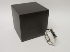 Gucci lady's bracelet watch, working order, c/w box & paperwork. Estimate £90-110.