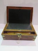 Large brass bound walnut writing slope with lock & key. Excellent condition. Estimate £50-80.