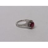 18ct white gold, ruby & diamond ring, wt 5.5gms, size K 1/2. Estimate £560-600.