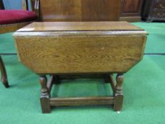 Small oak drop-leaf table, height 45cms. Estimate £5-10.