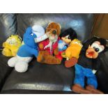 Quantity of vintage stuffed toys: Basil Brush, Mickey, Goofey, 2 Garfields & 3 Smurfs. Estimate £