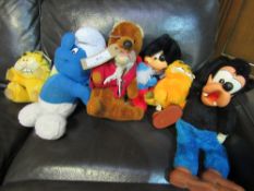 Quantity of vintage stuffed toys: Basil Brush, Mickey, Goofey, 2 Garfields & 3 Smurfs. Estimate £