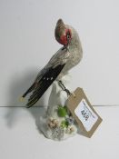 Continental china bird figurine. Estimate £90-100.