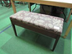 Double piano stool with upholstered lifting seat, 88cms x 36cms x 50cms. Estimate £20-30.