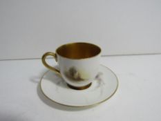 Royal Worcester porcelain coffee cup and saucer decorated with pheasants, with heavily gilded