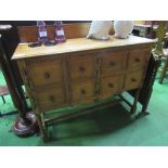 Oak sideboard with 2 drawers & cupboard on turned supports & stretcher base, 121cms x 90cms x 49cms.