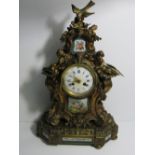 Ornate mantel clock with enamelled panel by Jules Bariquand, Paris