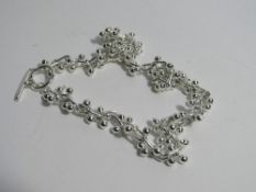 Silver 'Barb Wire' necklace, marked Tiffany 925. Estimate £15-30.