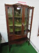 Inlaid mahogany bow-fronted display cabinet with shelf below, 92cms x 39cms x 165cms. Estimate £40-