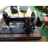 Antique Frister & Rossmann sewing machine in case c/w key. Estimate £25-35.