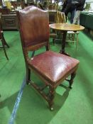 Leather upholstered mahogany dining chair. Estimate £20-30.