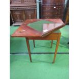 Mahogany swivel 'envelope' top card table on tapered legs to castors. Estimate £100-120.