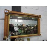 Maple veneer wall mirror, 106cms x 65cms. Estimate £10-20.