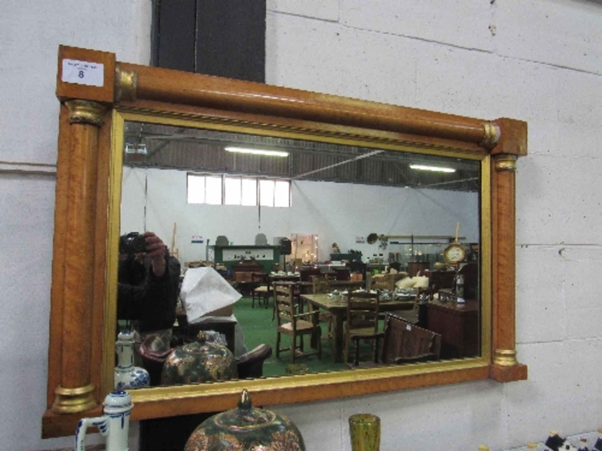 Maple veneer wall mirror, 106cms x 65cms. Estimate £10-20.