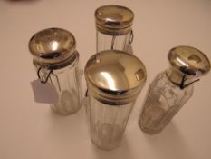 4 various dressing table pots with silver lids, 3x 1919 & 1900. Estimate £30-40.