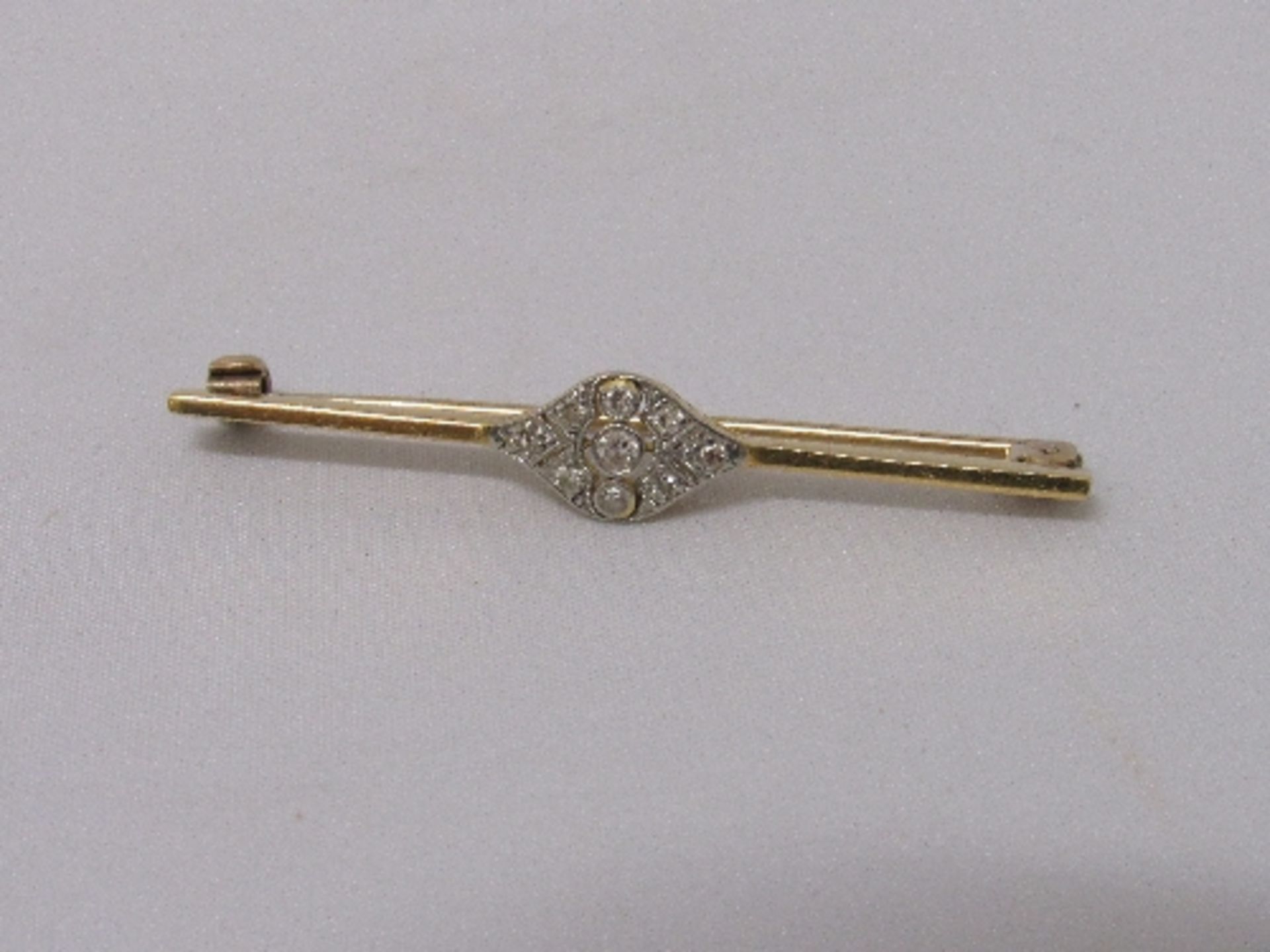 Diamond & gold coloured metal tie-pin, weight 3.9gms. Estimate £80-100.