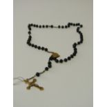 Rosary bead necklace. Estimate £30-40.