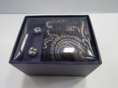 William Hunt (Saville Row) silk tie & cufflink set. Estimate £10-20.