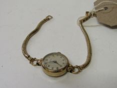 9ct gold cased lady's wrist watch by H L Brown with 9ct gold strap.