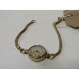 9ct gold cased lady's wrist watch by H L Brown with 9ct gold strap.