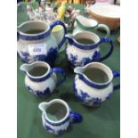 5 graduated ironstone blue & white jugs & 2 other jugs. Estimate £10-20.