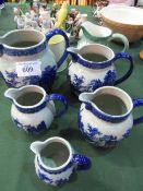 5 graduated ironstone blue & white jugs & 2 other jugs. Estimate £10-20.