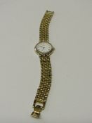 Seiko lady's wrist watch with yellow metal bracelet (not going). Estimate £10-15.