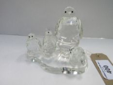 Crystal penguin family. Estimate £10-20.