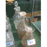 4 cut glass decanters. Estimate £20-30.