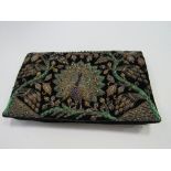 Hand stitched clutch bag brought back from Burma in WWII. Estimate £20-30.