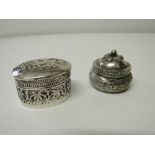 Pair of decorated Indo/Persian solid silver pill boxes. Estimate £40-50.