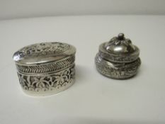 Pair of decorated Indo/Persian solid silver pill boxes. Estimate £40-50.