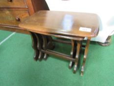 An Ercol nest of 3 tables. Estimate £20-30.