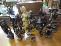 13 Ethnic carved figurines. Estimate £20-30.