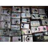 2 boxes of approx 60 digital cameras. Estimate £40-60.