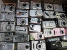 2 boxes of approx 60 digital cameras. Estimate £40-60.