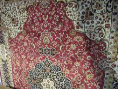 Red ground Keshan carpet, 280cms x 200cms. Estimate £80-100.