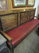 Oak bench with red leather upholstered seat, 181cms x 41cms x 104cms. Estimate £25-40.